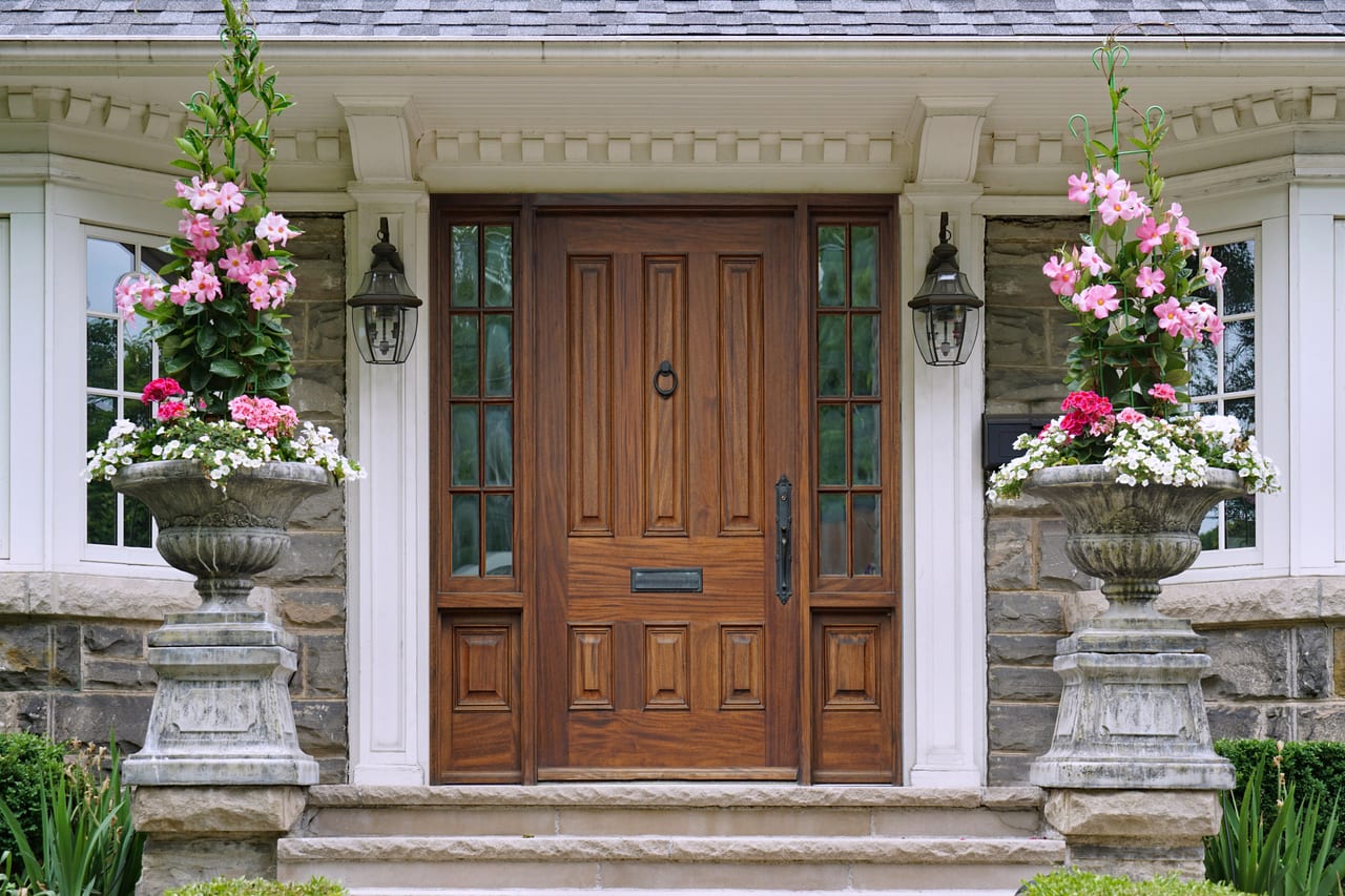 Elegant wooden front door with sidelights installed by Glass and Door Pro in Monroe, NC