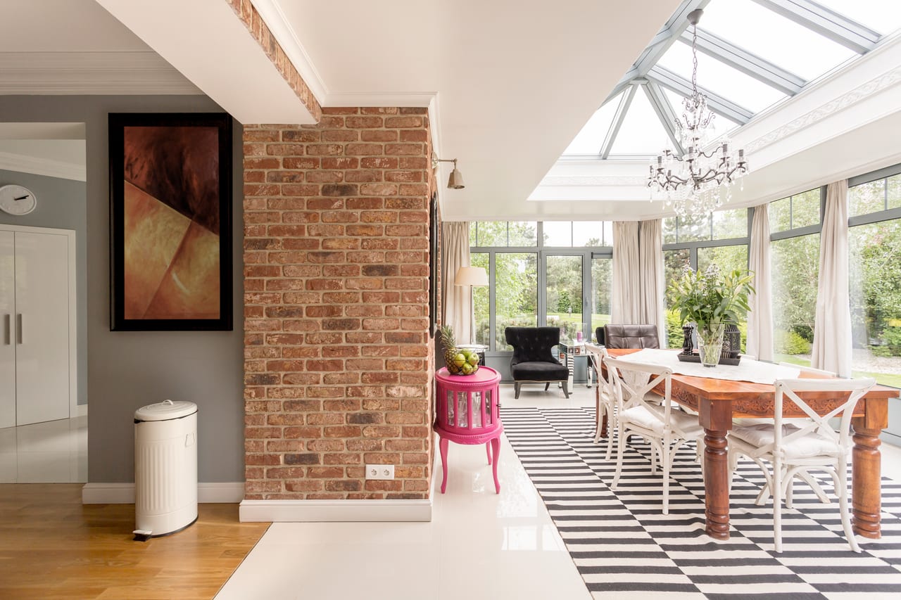Bright sunroom with large glass windows installed by Glass and Door Pro in Indian Trail, NC