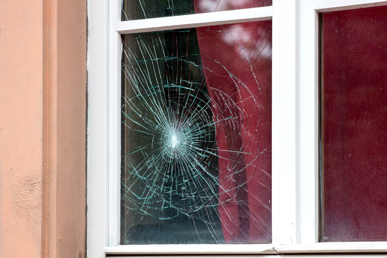Broken residential window glass needing repair by Glass and Door Pro in the Charlotte, NC metro area